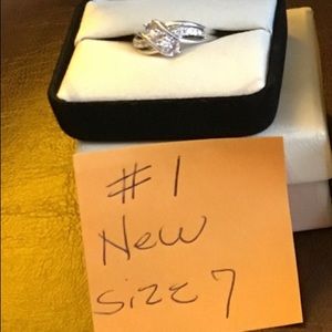 Brand new beautiful sterling silver/ white Tozaz stone size 7 ring. Ring #1